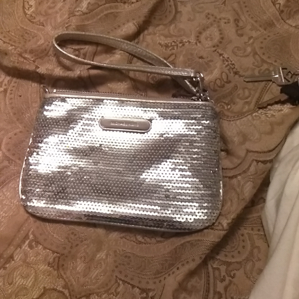 Michael kors Silver hand purse brand new.